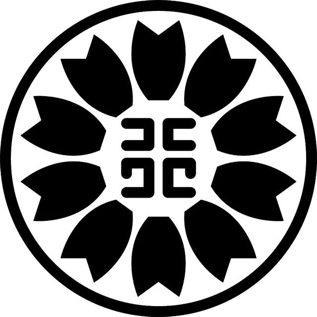 Circular black emblem featuring a flower-like ring of eight petals around a central geometric monogram.
